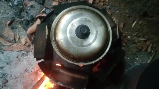 Traditional Cooking Pot on a Wood-Fired Stove
