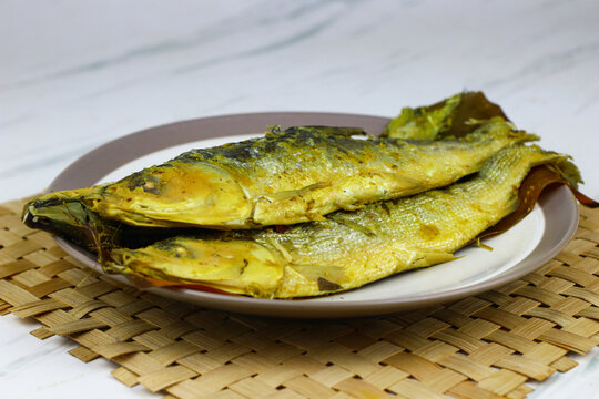 Traditional Indonesian presto milkfish cooked under pressure until tender, with softened edible bones. A popular local seafood dish known for its savory flavor and nutritious protein.
