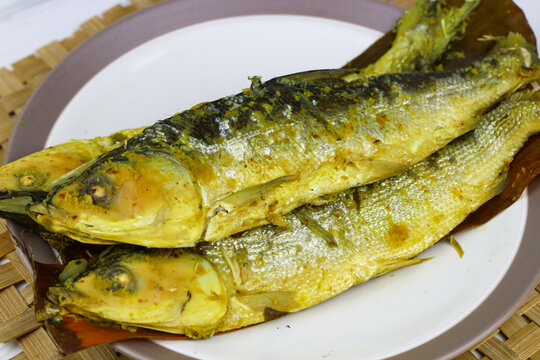Traditional Indonesian presto milkfish cooked under pressure until tender, with softened edible bones. A popular local seafood dish known for its savory flavor and nutritious protein.