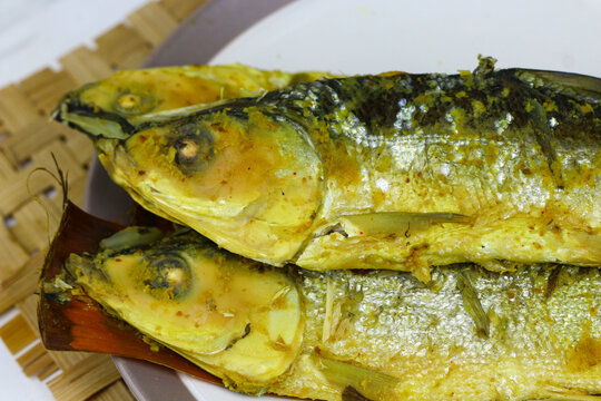 Traditional Indonesian presto milkfish cooked under pressure until tender, with softened edible bones. A popular local seafood dish known for its savory flavor and nutritious protein.