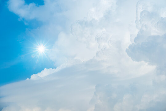Panorama view clear blue sky meets a glowing white horizon, suggesting a serene, open, and with sunlight of beautiful cloudy sky. landscape or nature sky background	