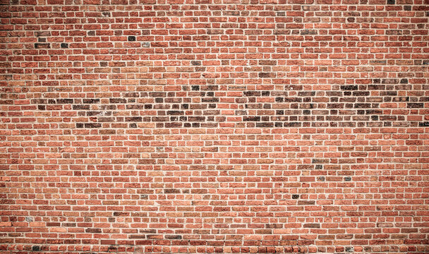 Red bricks brickwall texture background. Old bricks masonry wall surface. Rustic bricks patterned wall texture. Grunge bricks classic wall.