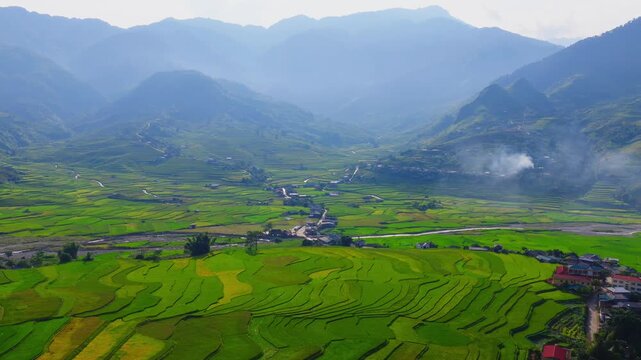 Aerial view of golden rice terraces at Khau Pha pass, near Mu Cang Chai town and Sapa city, Vietnam.