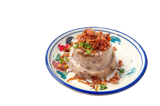 Steamed Taro Yam Cake on a Decorative Plate. Isolated on transparent background.