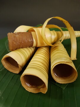 Kue Corot, Indonesian traditional dessert made of rice flour and palm sugar wrapped in coconut leaf