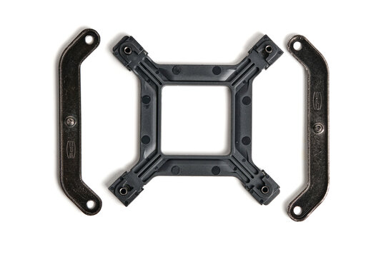 Plastic CPU cooler mounting backplate and metal brackets isolated top view on white background.