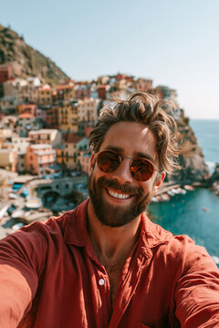 Selfie in a European City smiling bearded traveler enjoying spectacular seaside village views during relaxing coastal vacation adventure abroad