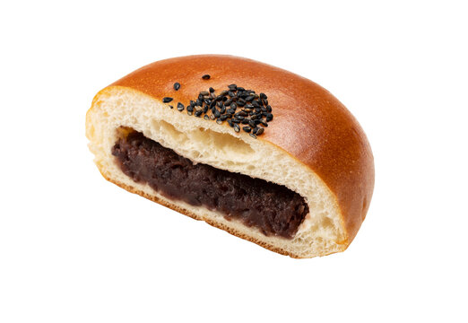 Japanese red bean paste bun Anpan cut in half showing sweet azuki filling isolated on transparent background