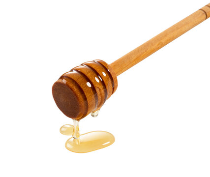 Honey dripping from wooden honey dipper wand isolated on transparent background