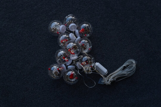 Christmas LED string lights with decorative transparent balls.