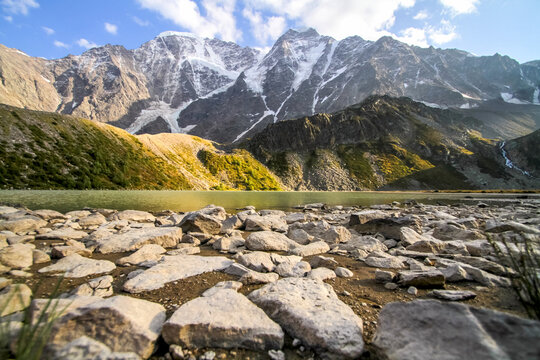Majestic snowy mountains towering over an alpine lake