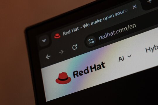 06 OCTOBER, 2026 - Tashkent, Uzbekistan: A computer screen displays the Red Hat website, highlighting its logo and URL. The image captures the essence of technology and open-source software.