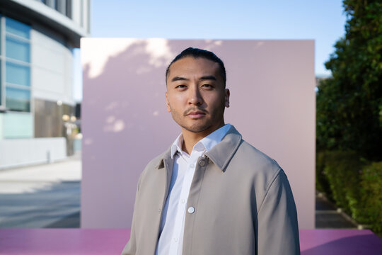 Portrait of man in beige jacket outdoors