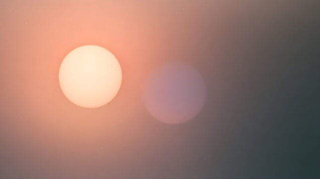 Two sun like discs in a dusty rose atmosphere