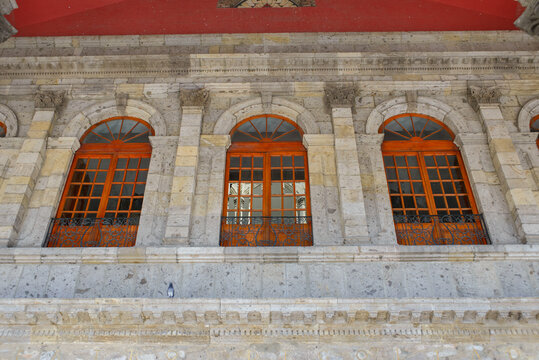 Majestic Historic Building Facade with Arched Wooden Windows