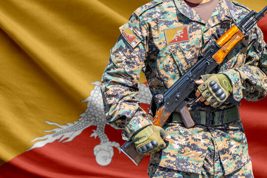 Bhutan flag with soldier in military uniform holding assault rifle in front of it