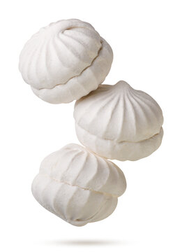 Marshmallows flying close-up on a white. Isolated