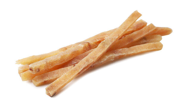 Pile of dried fish strips close-up on a white background. Isolated