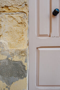 Pale Pink Wooden Door Detail and Aged Stone Wall Texture, Vintage Panelled Surface