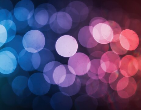 Abstract background with blurred blue and pink circular bokeh lights