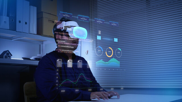 Businessman using VR headset to manipulate digital data interfaces and floating analytics charts	
