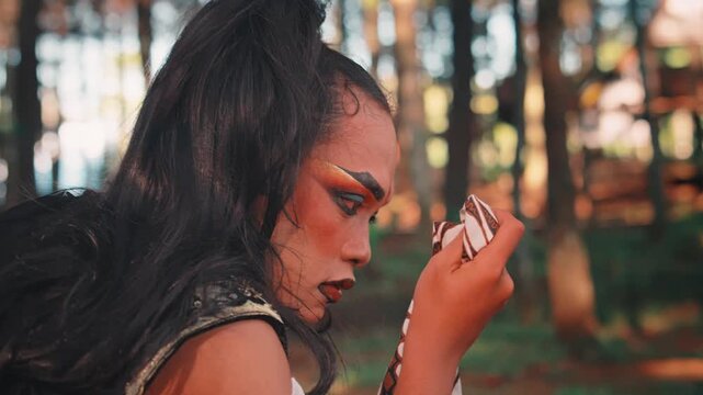 Javanese Man with Makeup Crying into a Batik Handkerchief