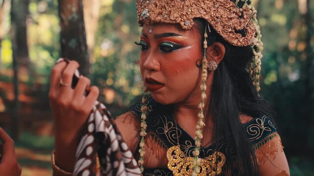 A Javanese Woman Comforting a Man in the Forest