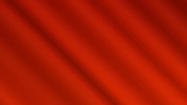 Vibrant bright red diagonal wavy fabric flowing gracefully in gentle motion creating smooth aesthetic background patterns