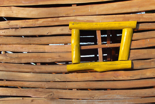 Wooden house with yellow window - playground house details