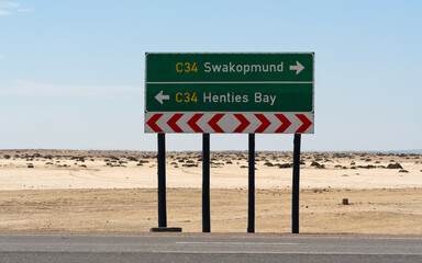 Road sign to Swakopmund and Henties Bay on a desert road, Namibia © Jeroen Kleiberg