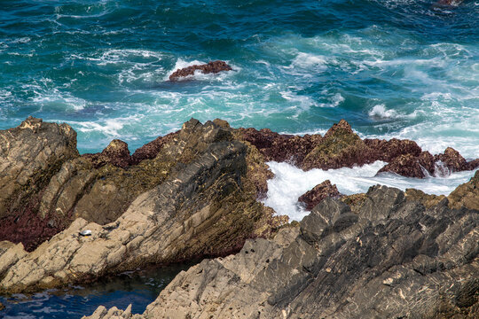 Rugged Coastal Landscape with Crashing Waves and Rocky Shore