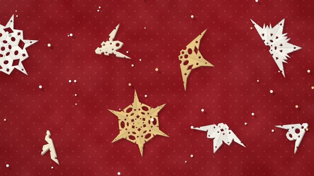 Paper cut snowflakes unfolding from folded triangles into six-fold winter patterns and folding back, seamless loop in rich red tones