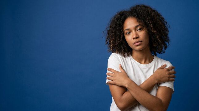 Embracing self-care, a young woman's thoughtful pose highlights the quiet strength in prioritizing Mental Health and personal well-being