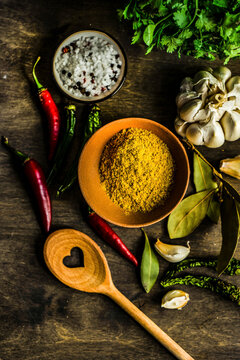 Brown bowl of georgian kharcho spice powder with chili peppers, garlic
