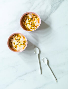 Banana cream dessert topped with passion fruit seeds