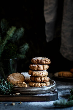 Stack of ginger biscuits dusted with powdered sugar