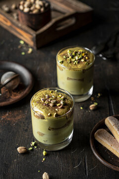 Pistachio matcha tiramisu layered dessert in glasses
