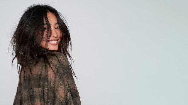 Asian girl with messy hair in oversized flannel shirt grunge style isolated on white background