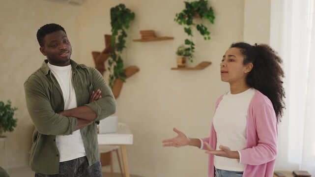 Annoyed African American woman arguing with husband, relationship problems