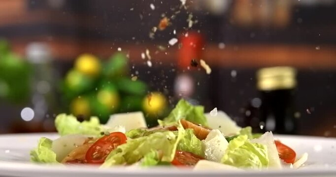 Caesar salad with falling spices in slow motion 1000 fps