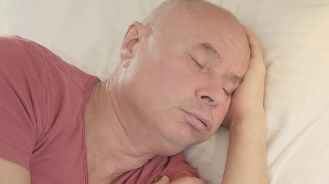 senior man rests deeply, eyes closed and face serene, Nighttime struggles, sleep disruption, anxiety in older adult, quiet moment true rest, reminding healing begins body finally surrenders to sleep