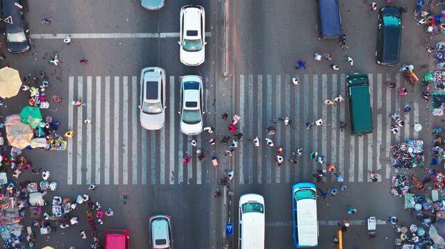 Aerial view showing local Kaneshie market with pedestrians, vehicles, and street vendors
