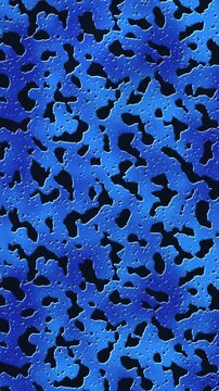 Seamless vertical pattern of blue camouflage texture with metal holes