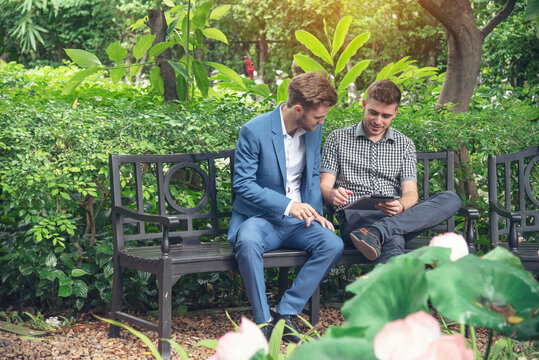 Portrait man relaxing in green park nature outdoors. Happy Relax man smiling face at outdoors garden. Men enjoy nature freedom lifestyle. Greenery wellbeing outside enjoy nature with copy space