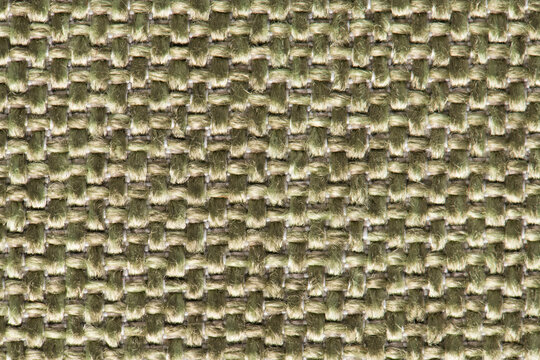 Close up of green textured fabric with a geometric woven basketweave pattern and soft matte surface finish