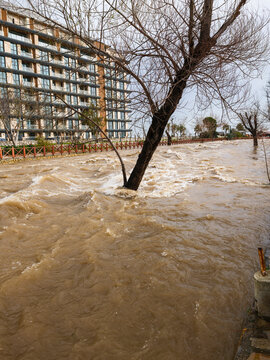 Muddy river overflowing after heavy autumn rainfall