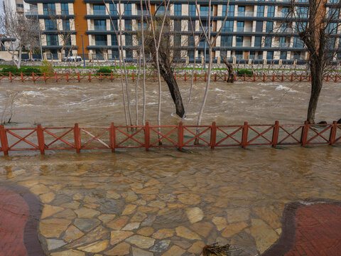 Muddy river overflowing after heavy autumn rainfall
