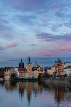 A view of Novotneho lavka - Smetanovo  embankment (Smetanovo nabrezi) with historical buildings and their reflection in Vltava River. Prague, Czech Republic 