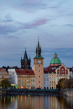 A view of Novotneho lavka - Smetanovo  embankment (Smetanovo nabrezi) with historical buildings and their reflection in Vltava River. Prague, Czech Republic 