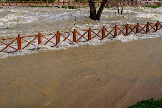 Muddy river overflowing after heavy autumn rainfall